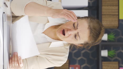 Vertical-video-of-Business-woman-upset-with-negative-paperwork-results.